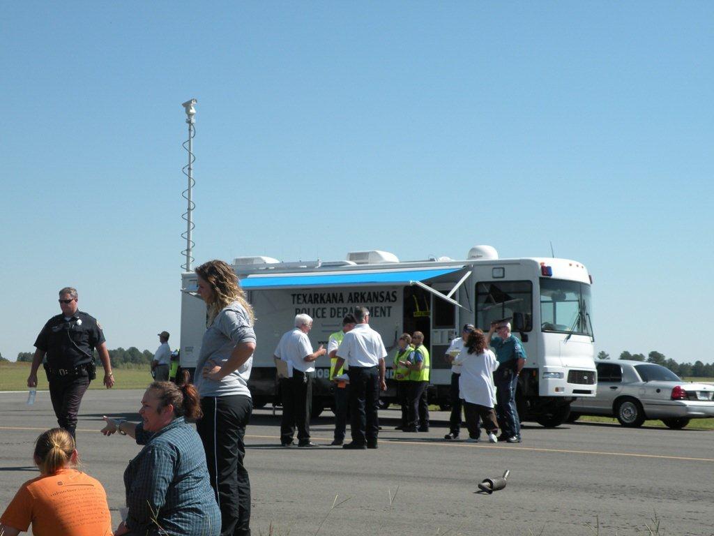 Police personnel standing near the command center.